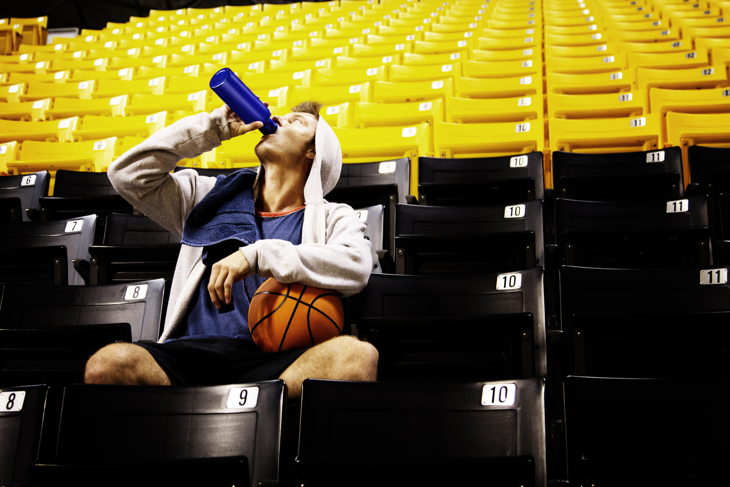 Man With Basketball Drinking Water While Sitting O 2022 03 09 02 31 05 Utc Scaled
