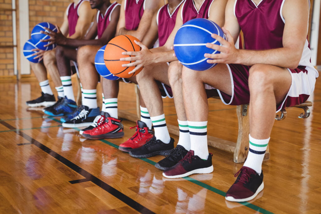 Basketball Players Sitting On Bench With Basketbal 2021 08 28 17 57 58 Utc