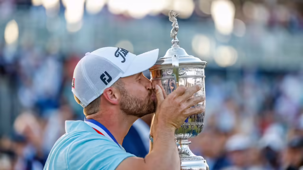 5 Ways to Make Money as a Sports Fan 4 as clark kissing trophy